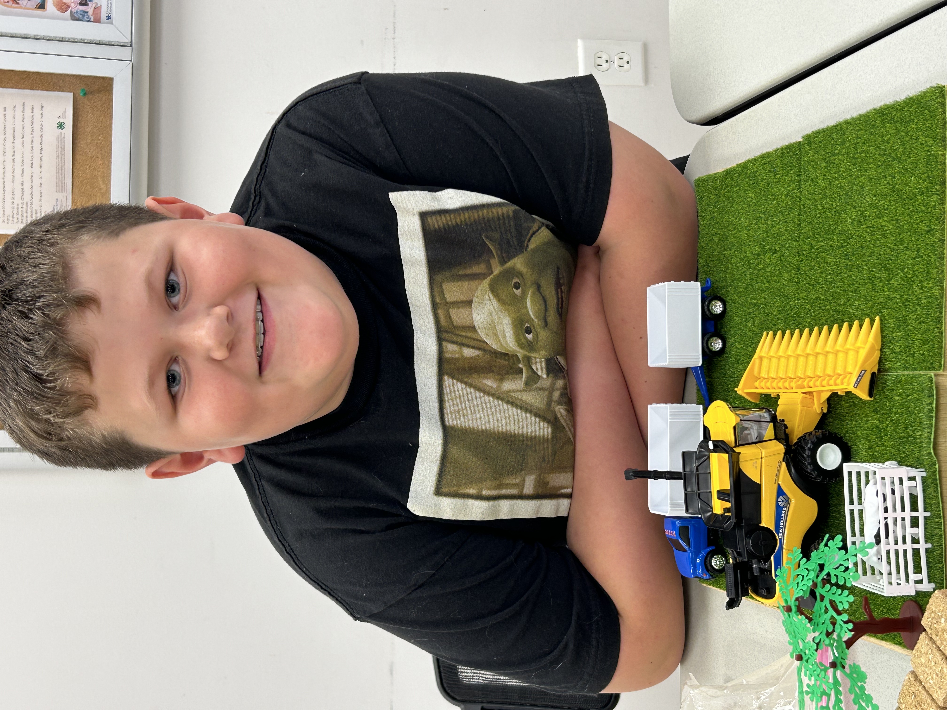 Boy with farm toys