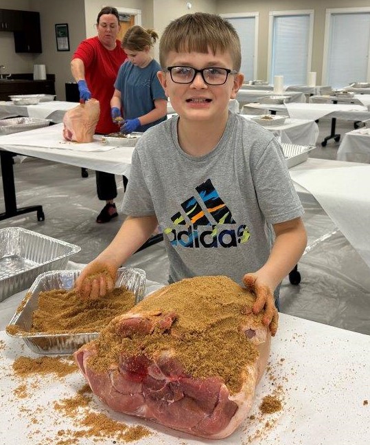 Boy curing country ham