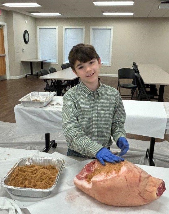 Boy curing country ham