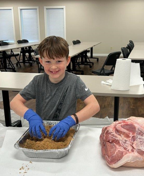 Boy curing country ham