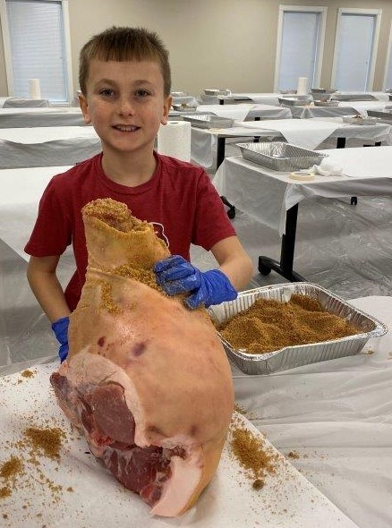 Boy curing country ham